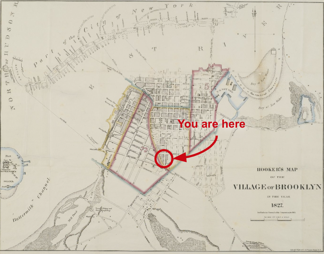 A map of the City of Brooklyn on old, yellowed paper with the words "You are here" superimposed digitally, pointing to the future location of 370 Jay Street.